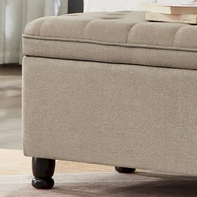 Banc de rangement capitonné en lin avec pieds en bois tournés
