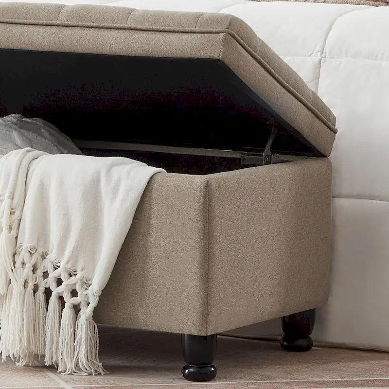 Banc de rangement capitonné en lin avec pieds en bois tournés
