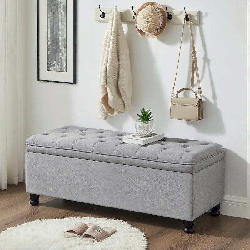 Banc de rangement capitonné en lin avec pieds en bois tournés