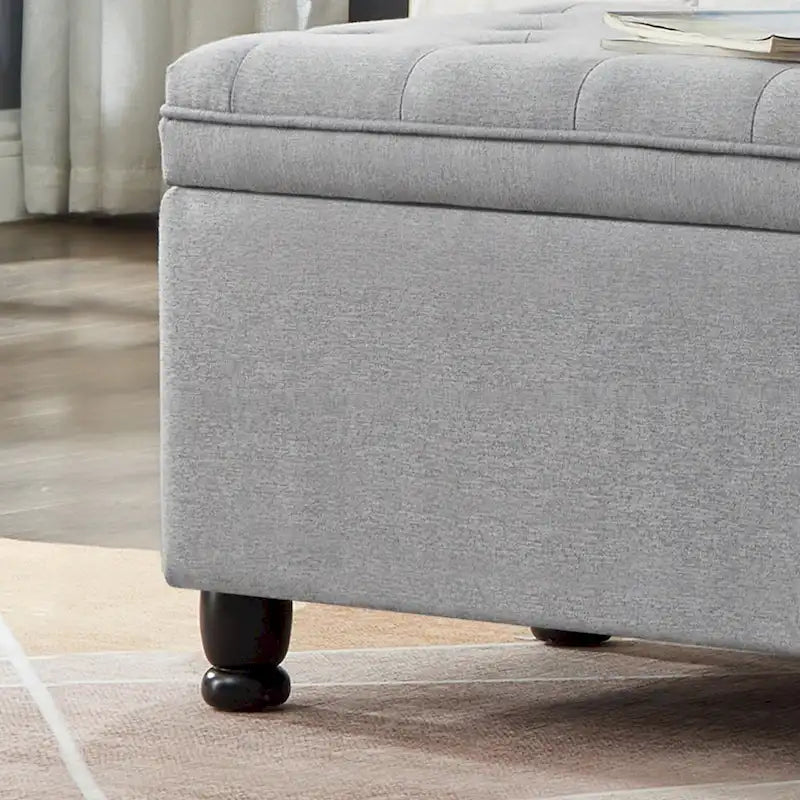 Banc de rangement capitonné en lin avec pieds en bois tournés