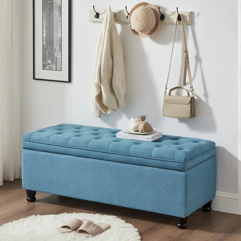 Banc de rangement capitonné en lin avec pieds en bois tournés