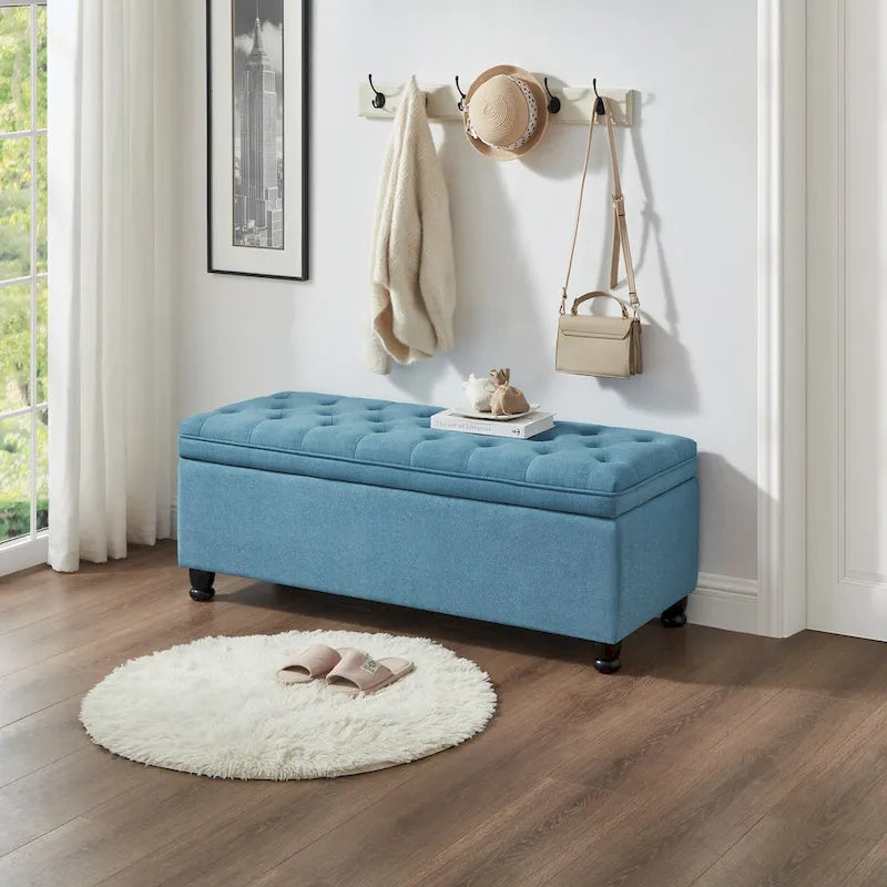 Banc de rangement capitonné en lin avec pieds en bois tournés