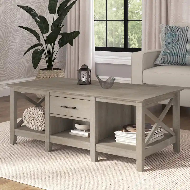 Mesa de centro blanca de estilo rústico con cajón y almacenamiento abierto, mesa para sala de estar con estructura lateral en forma de X