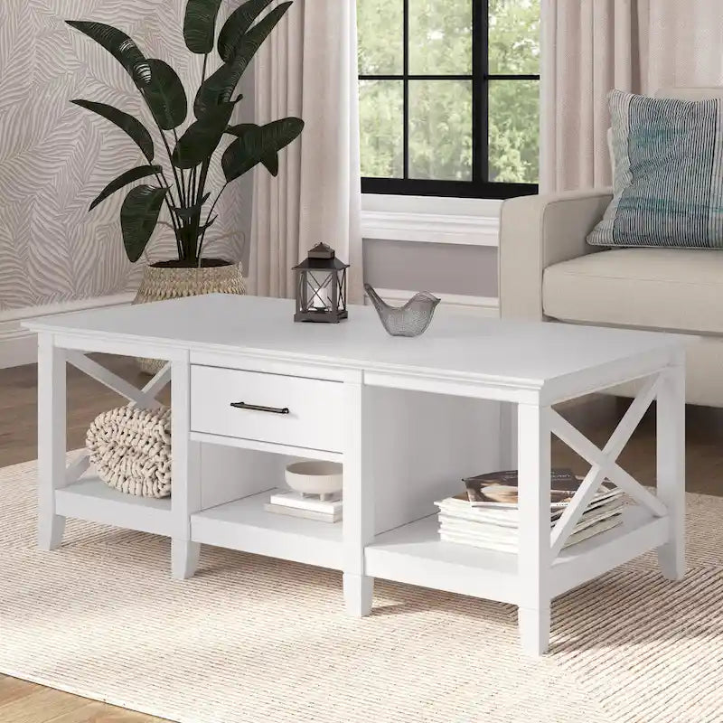 Mesa de centro blanca de estilo rústico con cajón y almacenamiento abierto, mesa para sala de estar con estructura lateral en forma de X